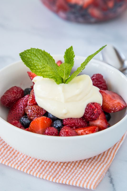 Easy fruit salad recipe with fresh strawberries, blueberries and raspberries.  Topped with a lemon yogurt.