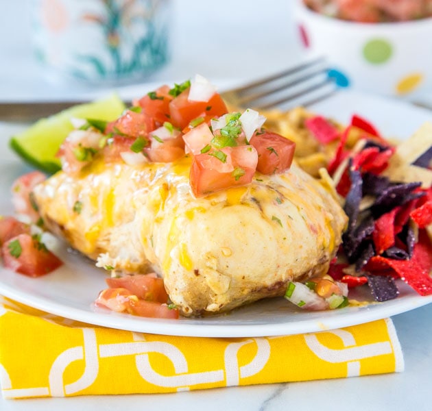 A plate of food on a table, with chicken and Lime