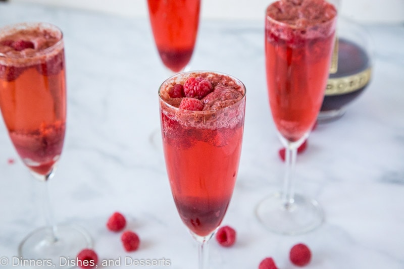 A glass of wine, with Raspberry and Mimosa