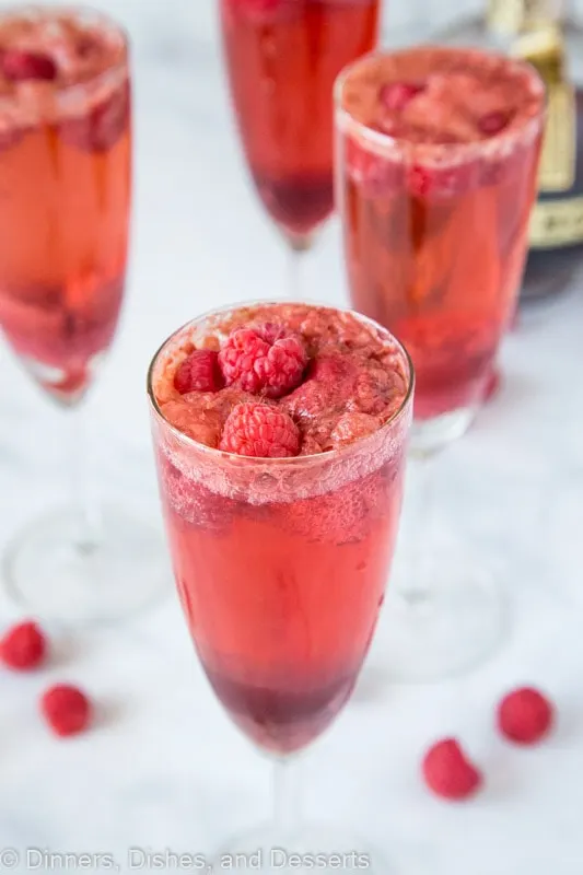 Mimosas made with fresh raspberries, chambord, champagne and raspberry sorbet