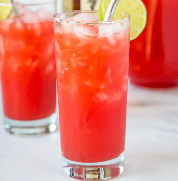 A close up of a glass of fruit punch, with Punch