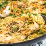 Close up of one skillet chicken with orzo.