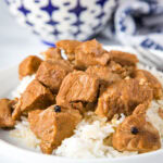 A plate of food with rice and meat