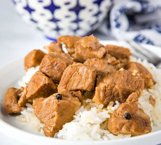 A plate of food with rice and meat