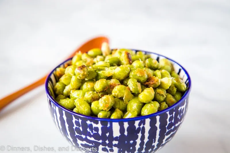 Parmesan Garlic Roasted Edamame - need a new way to get your kids to eat their vegetables?Â  These soy beans are roasted until crispy and coated in Parmesan cheese.Â  Great for picky eaters!Â 