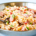 A bowl of food with rice and vegetables