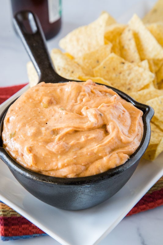Refried beans come together with cream cheese, cheddar cheese and taco flavors for a great dip
