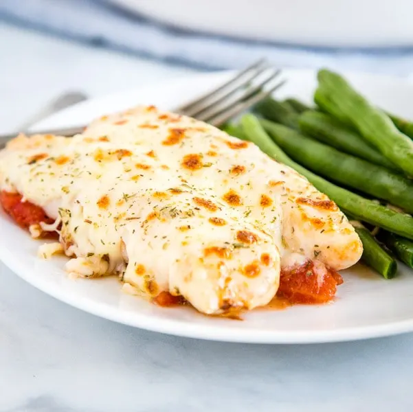 A plate of food on a table, with Chicken