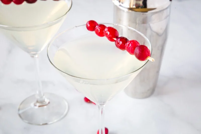 Winter White Cosmo - a fun seasonal twist on the classic Cosmopolitan cocktail.  Fruity, tart, slightly sweet and delicious.  Great for your holiday parties!  