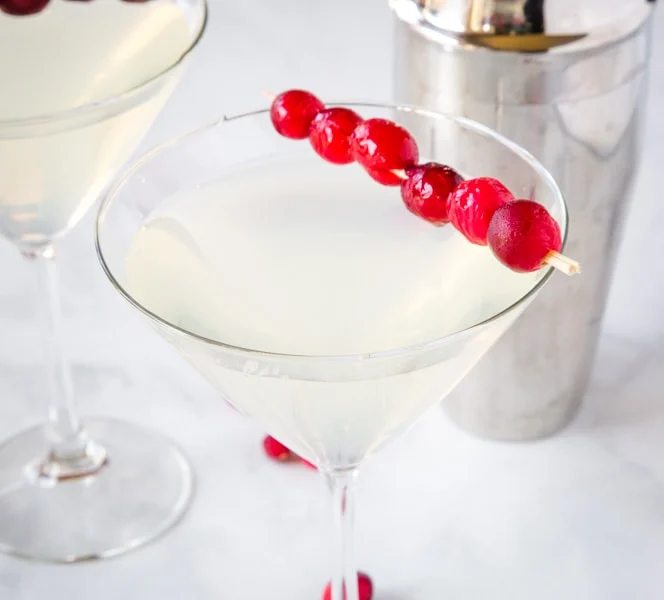 Winter White Cosmo - a fun seasonal twist on the classic Cosmopolitan cocktail.  Fruity, tart, slightly sweet and delicious.  Great for your holiday parties!  