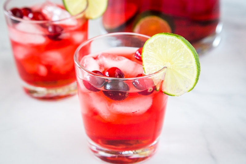 Christmas Punch Recipe - an easy and delicious holiday punch filled with cranberries, cranberry juice, pineapple juice and more!  A non-alcoholic version is included, or add in the vodka for a fun and festive holiday! 