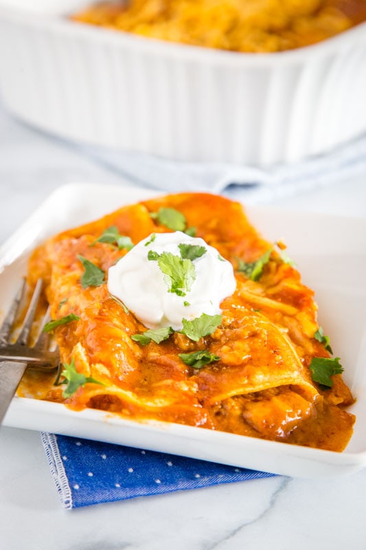 Enchiladas are a Mexican favorite and super easy to make at home.  These are filled with ground beef, cheese and onions