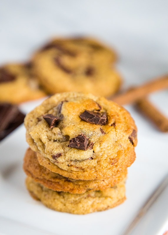A close up of cookies on a plate, with Cookie and Chocolate chip
