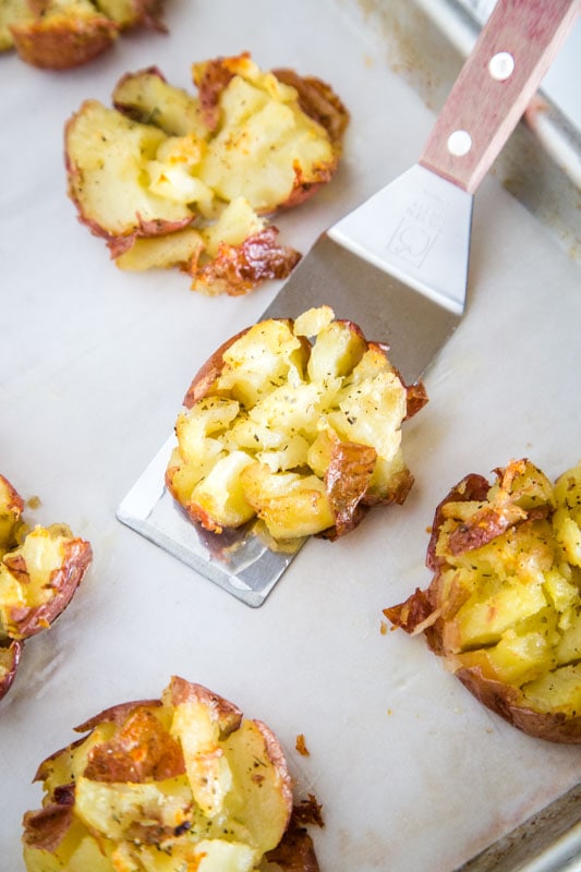 Crispy smashed potatoes with garlic and butter