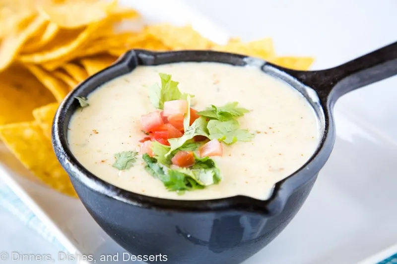 Mexican White Queso Dip - Similar to the white cheese sauce served at Mexican restaurants. It is creamy, has just a little spice to it and is the perfect addition to any party!  