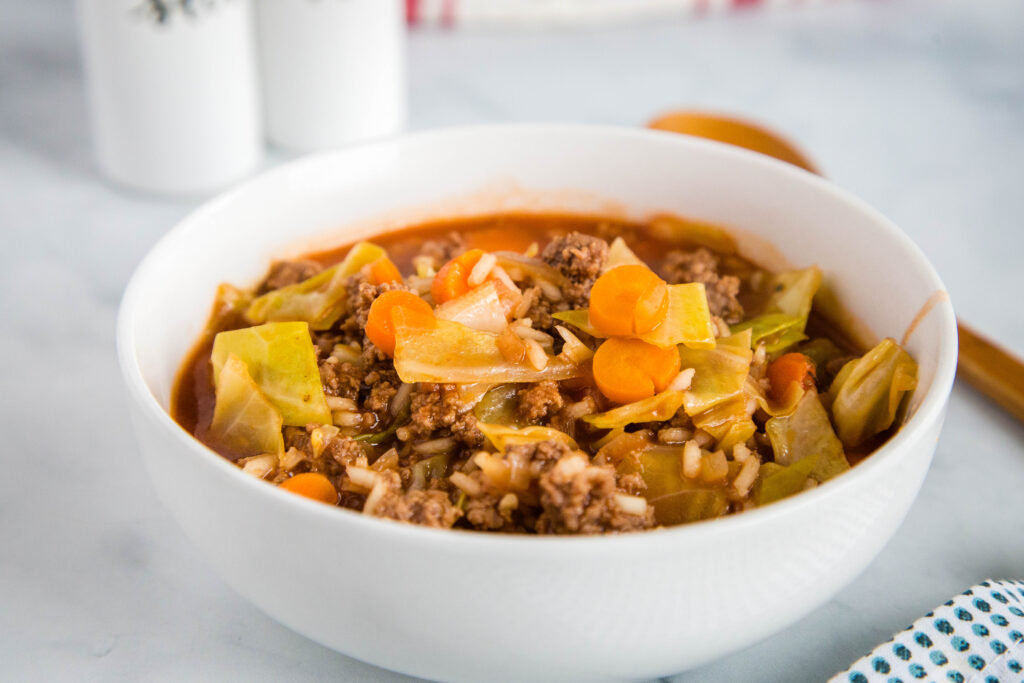 Cabbage Roll Soup - a simple soup that has all the taste of traditional stuffed cabbage rolls that is ready in minutes.  It is hearty, filling, healthy and delicious!