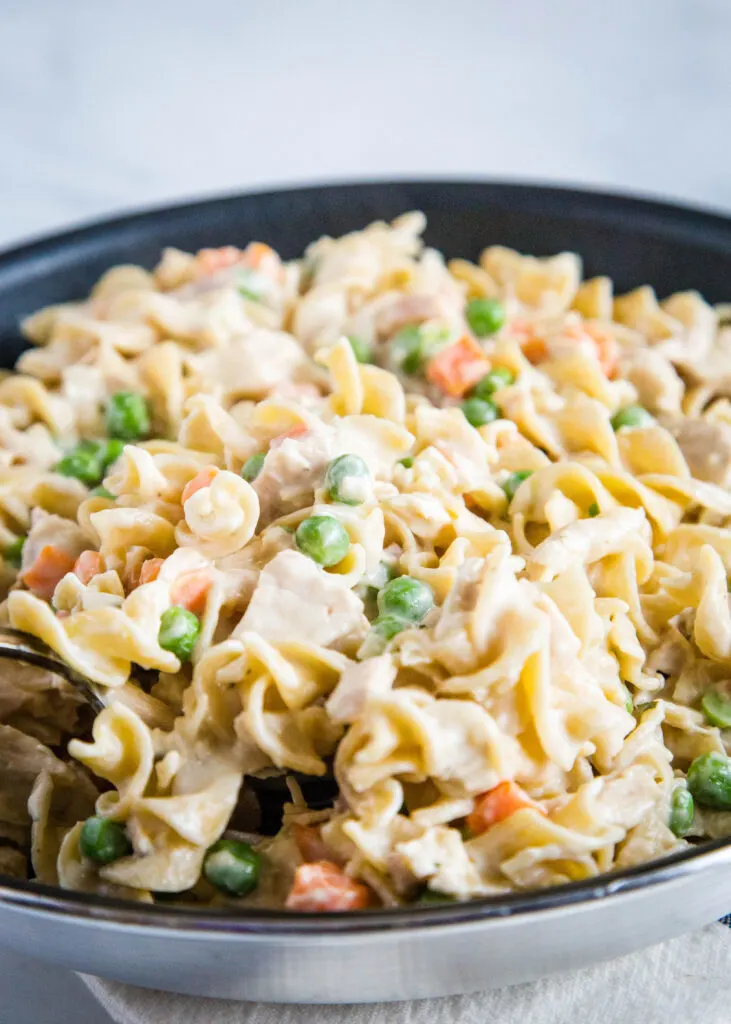 Chicken pot pie pasta is a quick and easy dinner you can make in about 20 minutes any night of the week!