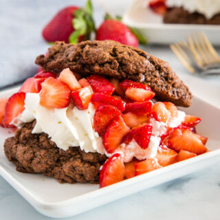Chocolate Strawberry Shortcake - Turn the classic strawberry shortcake into a chocolate dessert with these chocolate biscuits as the base.  Topped with homemade whipped cream and lots of fresh strawberries for an over the top dessert!