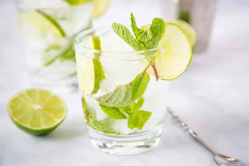 Mojito Margarita - The perfect combination of two of your favorite cocktails!  This is a blend of a classic mojito and a classic margarita for a delicious and refreshing Mojito-rita!