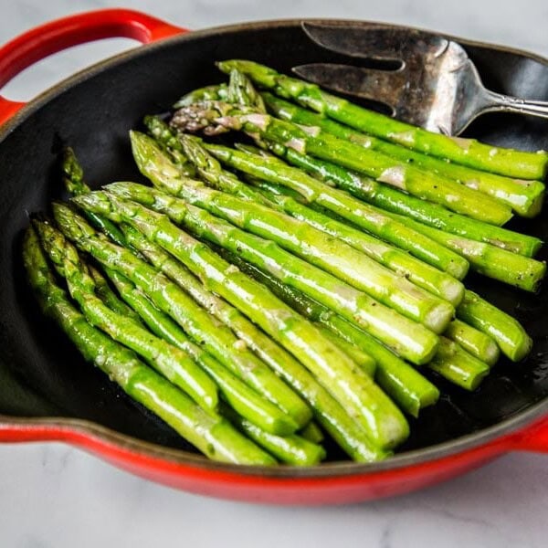 Sauteed Asparagus - super simple side dish with asparagus sauteed in butter, garlic and seasoned with salt and pepper. Ready in just minutes, healthy, and goes with just about everything. Â