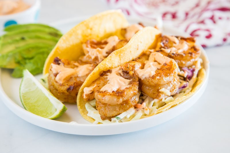 Chipotle Shrimp Tacos - An easy shrimp taco recipe with spiced shrimp, a cool lime coleslaw, and topped with creamy chipotle sauce.  Packed with so much flavor and ready in minutes, so it is perfect for a weeknight dinner.