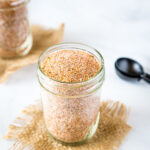 A jar of spices on a table, with Ribs