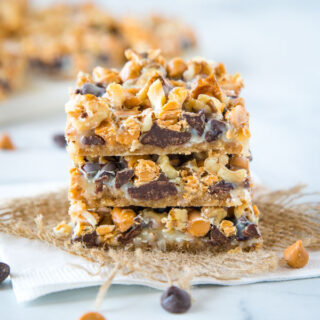 Magic Cookie Bars - These bars come together in one pan and are so easy to make.  Layers of graham crackers, chocolate, butterscotch, coconut, nuts and sweetened condensed milk.
