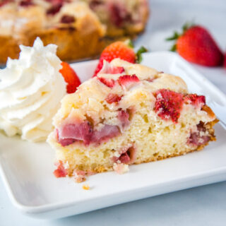 Easy Strawberry Cake - Use fresh strawberries to make this tender and delicious cake.  It has a tasty sugary crust on the outside and is moist and almost custardy center.  It is super easy to make and great for any occasion. 