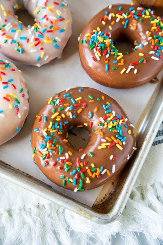 Yeast donuts made at home topped with vanilla or chocolate icing