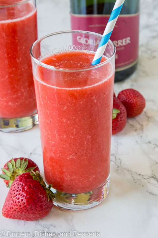 strawberry frose in a glass with straw