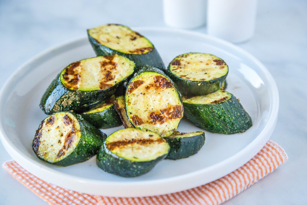 Grilled Zucchini - throw zucchini on the grill for a quick and easy side dish.  It is ready in just minutes, is deliciously healthy and perfect with just about any summer meal!