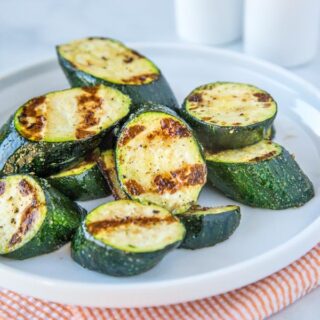 Grilled Zucchini - throw zucchini on the grill for a quick and easy side dish.  It is ready in just minutes, is deliciously healthy and perfect with just about any summer meal!