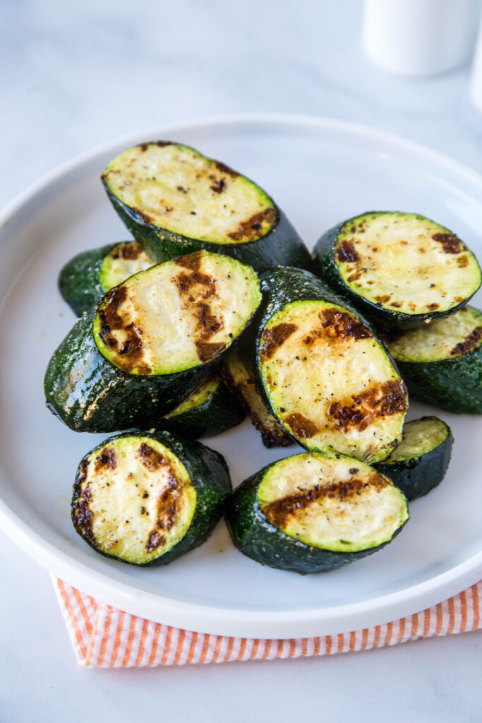 grilled zucchini on a plate for a easy summer side dish