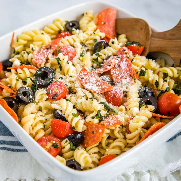 A dish is filled with food, with Pasta and Salad