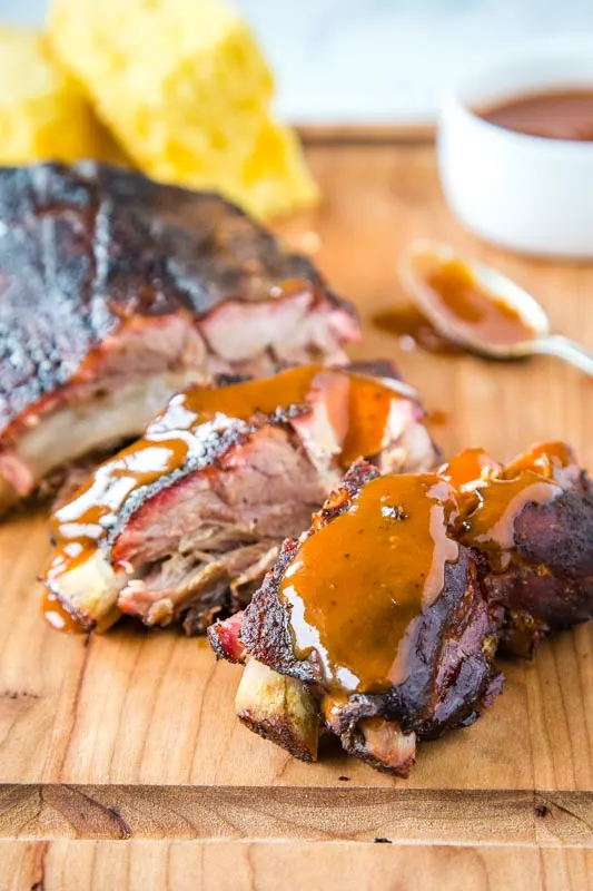 Make baby back ribs on the smoker and brush with barbecue sauce