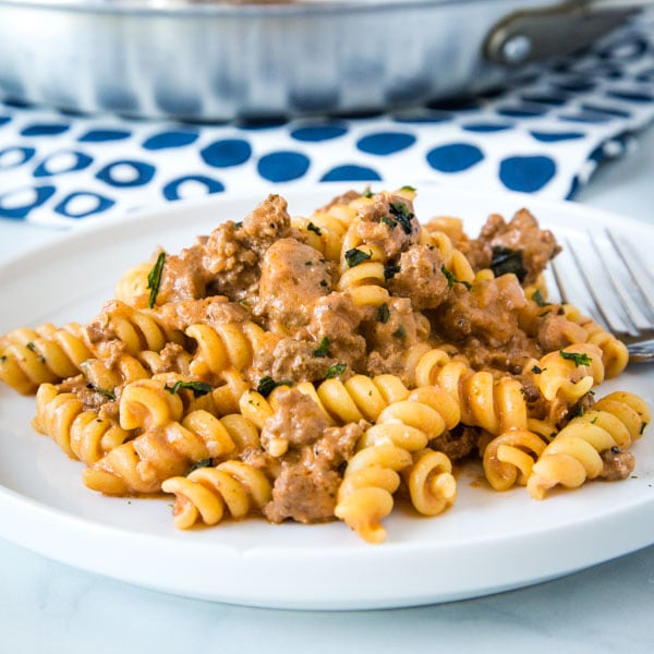 Creamy Beef Pasta - an easy recipe that gets dinner on the table the whole family will love any night of the week!  Creamy, hearty, and perfect for those picky eaters.