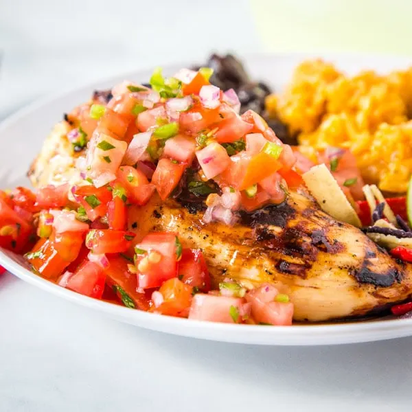 Margarita Grilled Chicken - a super easy copycat recipe from Chili's restaurant.  Flavorful chicken grilled and topped with a fresh pico de gallo for an easy and delicious dinner. 