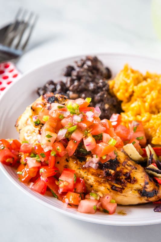 grilled chicken with tomatoes on top