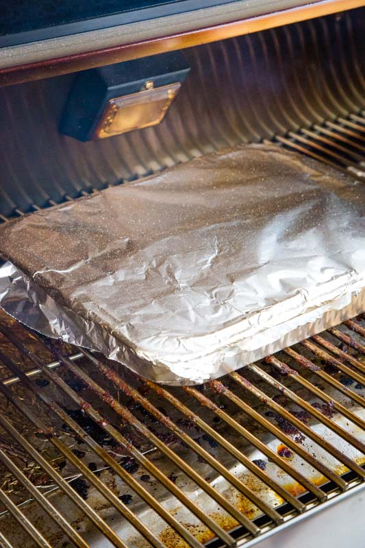 pan wrapped in foil on a grill