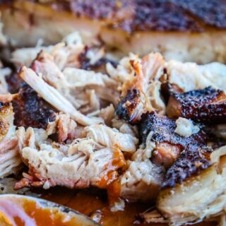 Smoked Pork Belly - the most tender and juicy pork you will ever have!  It is cooked low and slow on the smoker and seasoned with a delicious rub.  Super easy, you will wonder why you have never tried it before! 