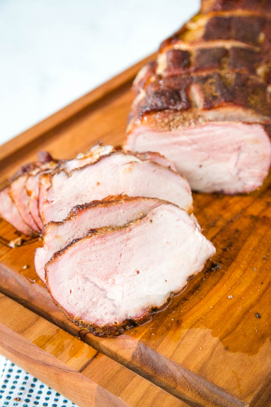 sliced pork roast on cutting board