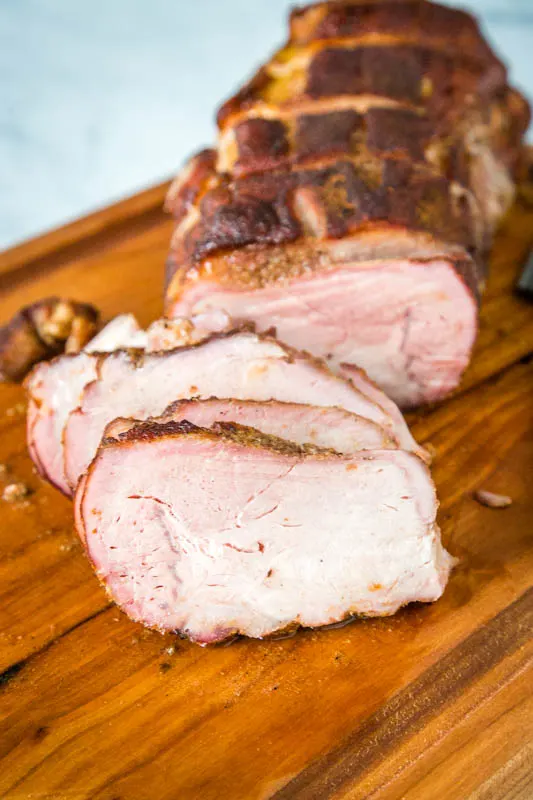 slices of pork roast on a cutting board