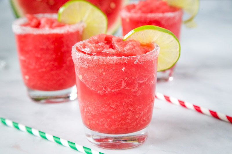 Watermelon Margaritas - Use fresh summer watermelon to make these fruit and delicious margaritas!  Great for entertaining or just because.  Recipe for both frozen and on the rocks included!
