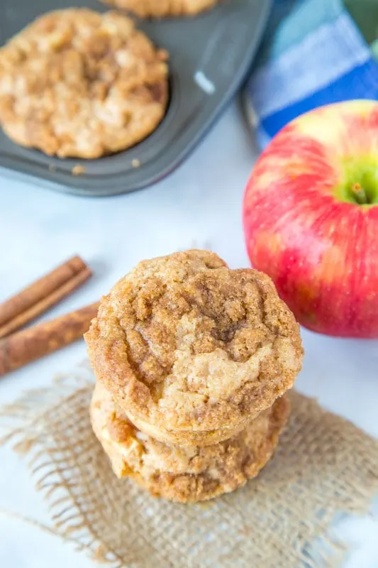 apple cinnamon muffins with an apple next to them