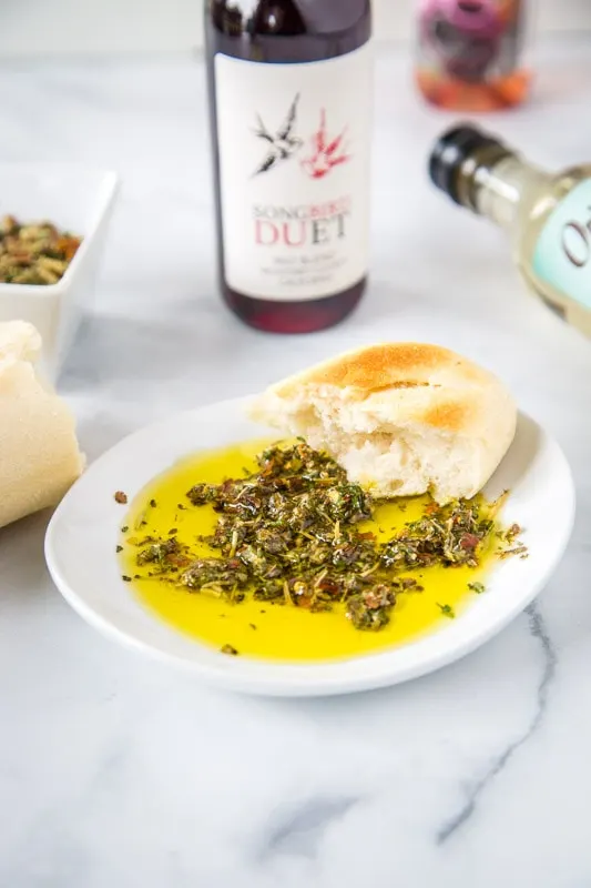 olive oil bread dip in white bowl