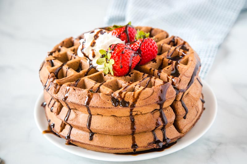Chocolate Waffles - Dessert for breakfast with these rich and chocolate-y waffles that are crisp on the outside and fluffy and tender on the inside.