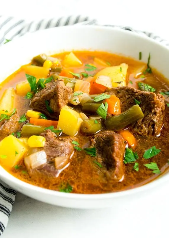 vegetable beef soup in white bowl