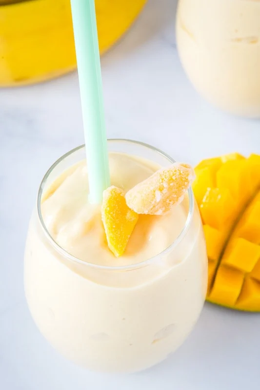 mango smoothie with chunks of mango on top