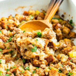 Sausage Stuffing - the BEST Thanksgiving dressing recipe with savory sausage and herb bread cubes. So easy to make and it is the perfect side dish for your holiday table.