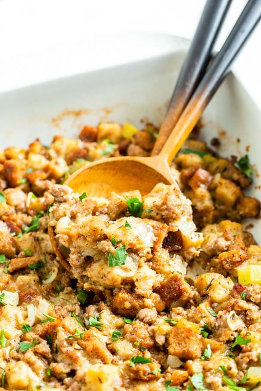 wooden spoon in casserole dish if thanksgiving dressing